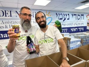 Electra Power employees  packing carefully food baskets for Rosh Hashanah